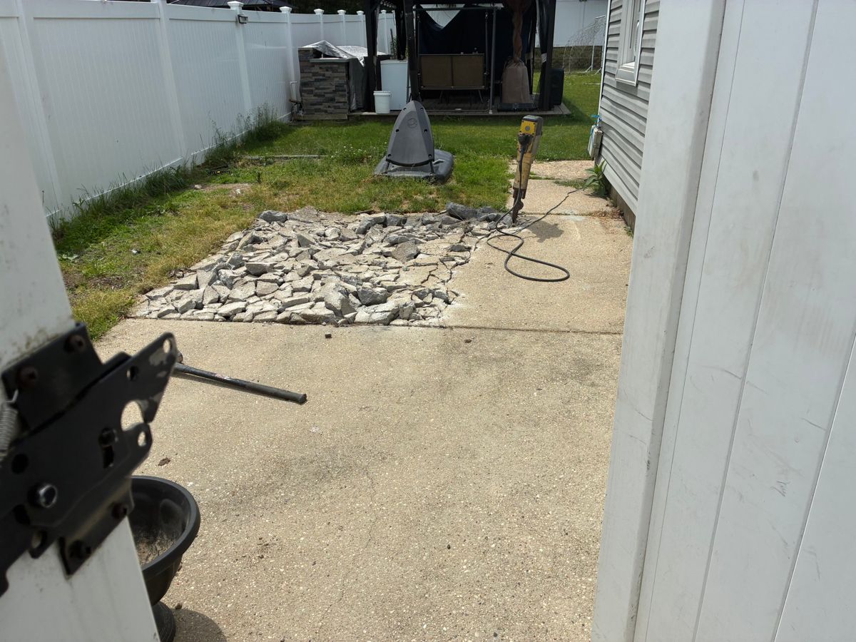 Concrete patio partly broken up with a jackhammer