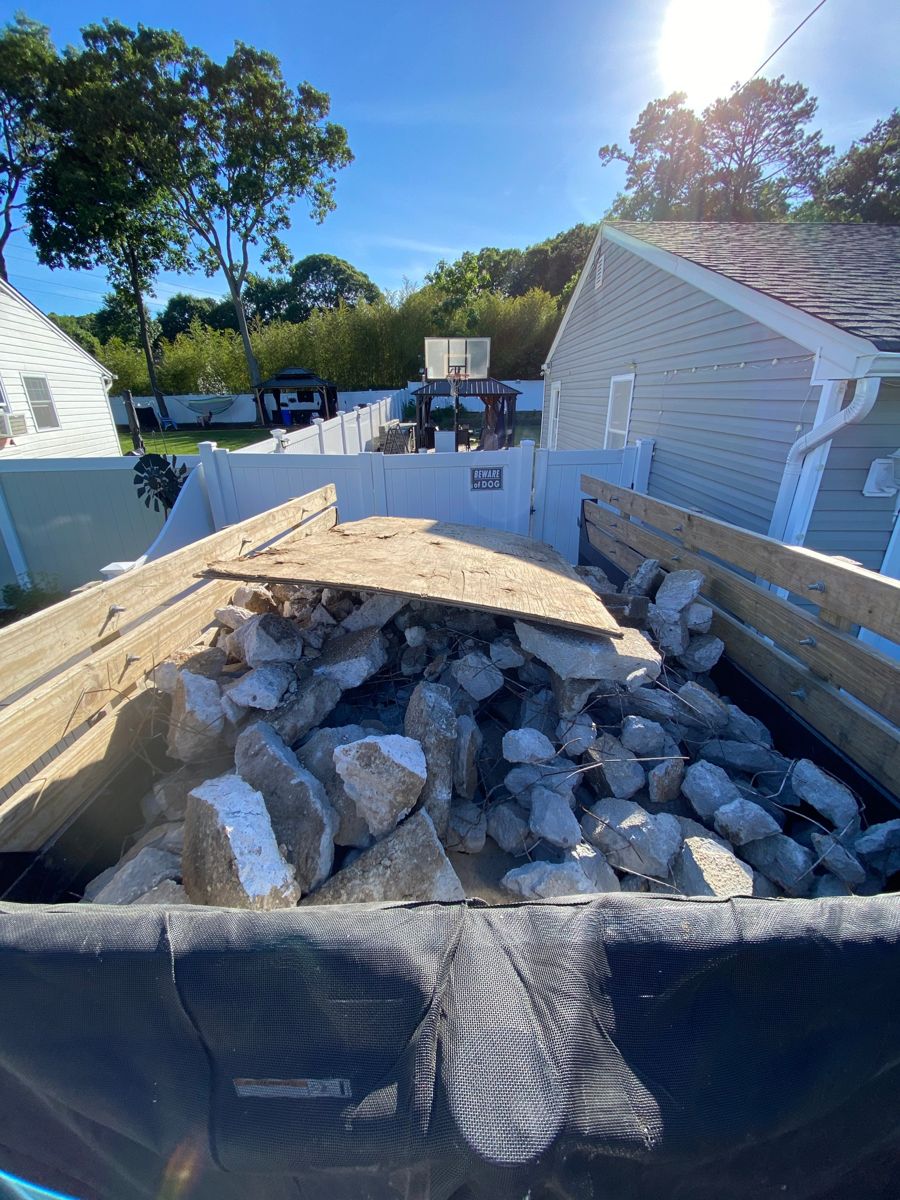 Dump trailer loaded with broken concrete