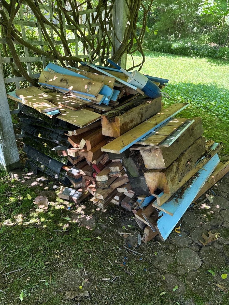 Stack of lumber, beams, and old shingles