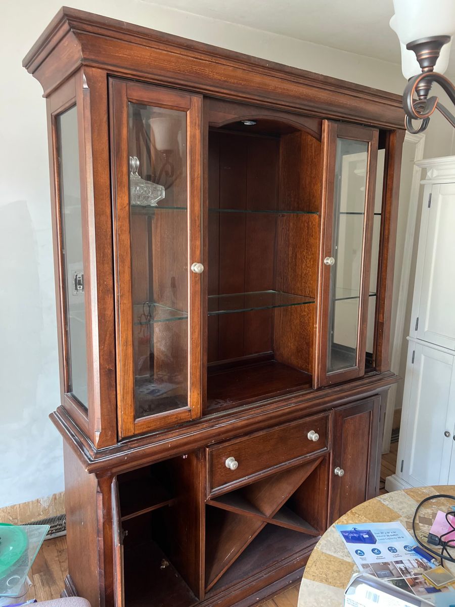 Dark wood china hutch with glass shelves