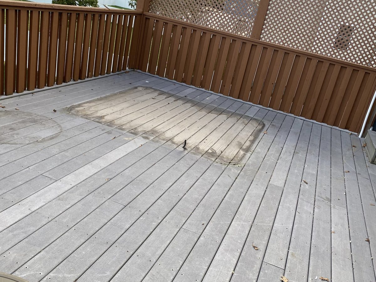 Clean deck with an outline where the hot tub used to sit